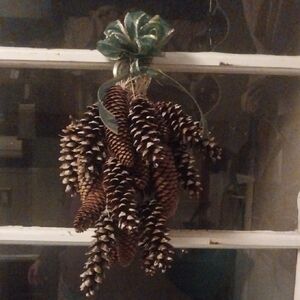 Festive Pinecone Holiday Decoration with Green Ribbon